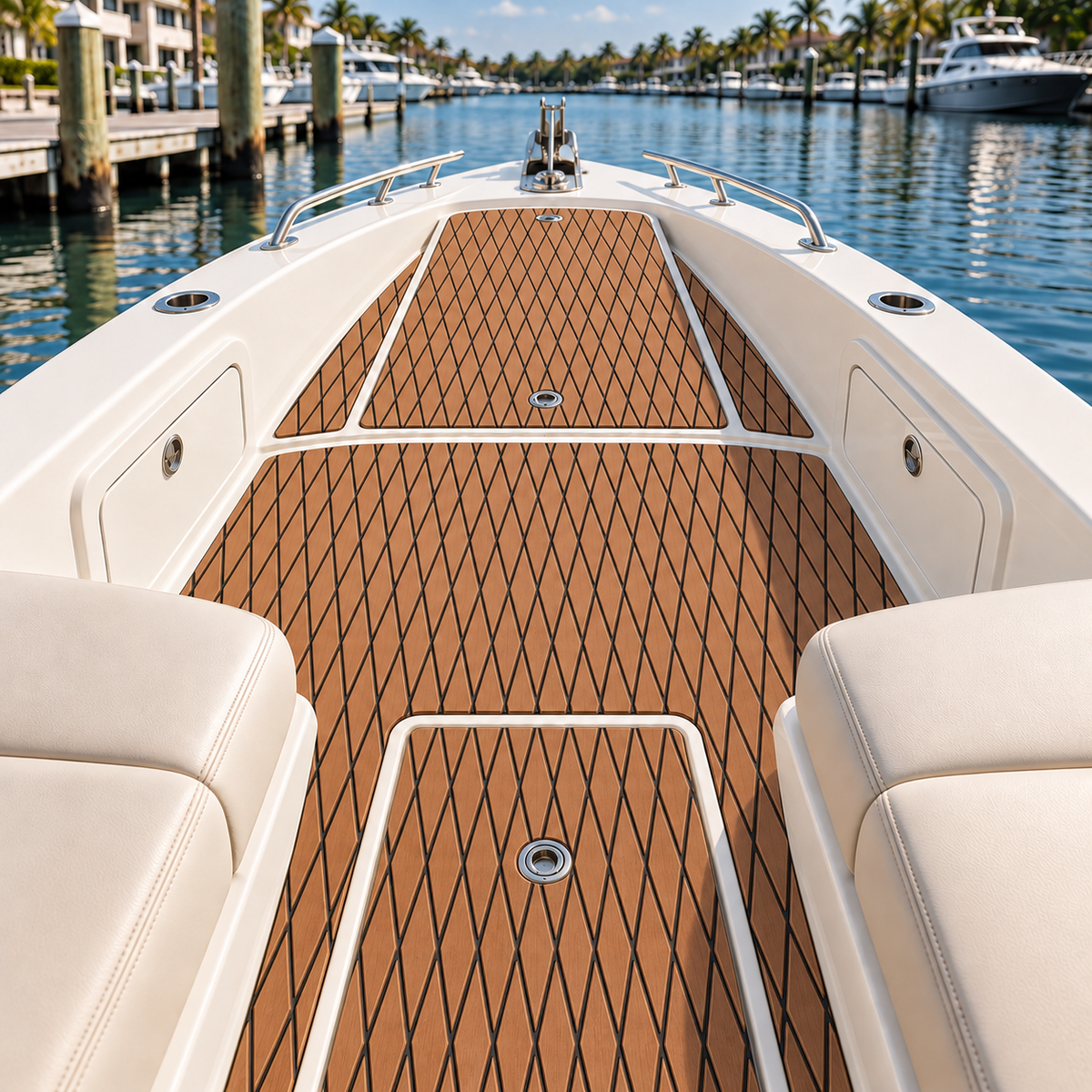 Warm brown diamond-pattern flooring fitted in separate panels around white bow-deck hatches and two round drains on a small boat