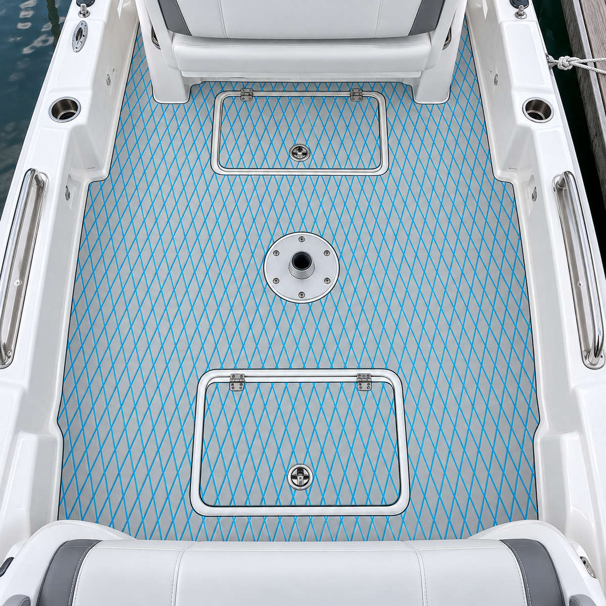 Overhead view of a white runabout cockpit with light-gray and blue diamond-pattern flooring around two storage hatches, a round seat pedestal base, and seat boundaries