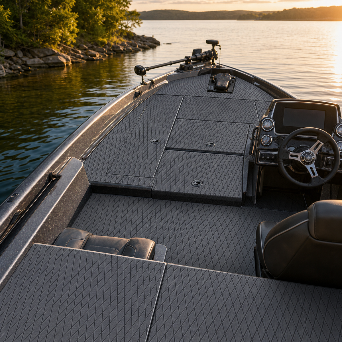 Bass boat casting deck with gray diamond-pattern flooring, storage hatches, a pedestal base, and a helm console at sunset